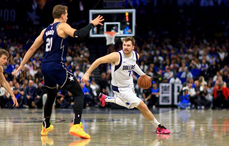 ORLANDO, FLORIDA - NOVEMBER 06: Luka Doncic #77 of the Dallas Mavericks drives to the basket during a game against the Orlando Magic at Amway Center on November 06, 2023 in Orlando, Florida. (Photo by Mike Ehrmann/Getty Images) NOTE TO USER: User expressly acknowledges and agrees that, by downloading and or using this photograph, User is consenting to the terms and conditions of the Getty Images License Agreement. (Photo by Mike Ehrmann/Getty Images)