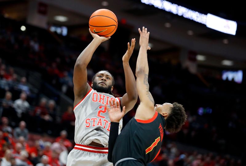 Mar 1, 2023; Columbus, Ohio, USA;  Ohio State Buckeyes guard Bruce Thornton (2) shoots over Maryland Terrapins guard Jahmir Young (1) during the second half at Value City Arena. Mandatory Credit: Joseph Maiorana-USA TODAY Sports