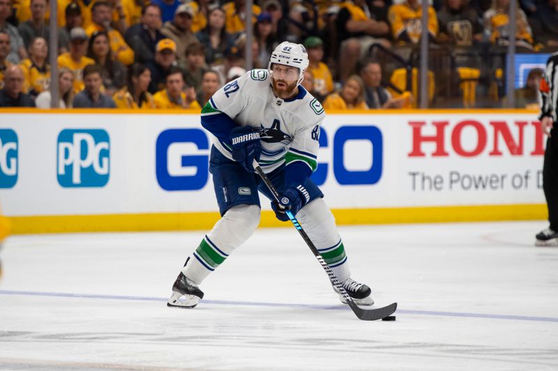 Apr 28, 2024; Nashville, Tennessee, USA; IVancouver Canucks defenseman Ian Cole (82) skates against the Nashville Predators during the first period n game four of the first round of the 2024 Stanley Cup Playoffs at Bridgestone Arena. Mandatory Credit: Steve Roberts-USA TODAY Sports