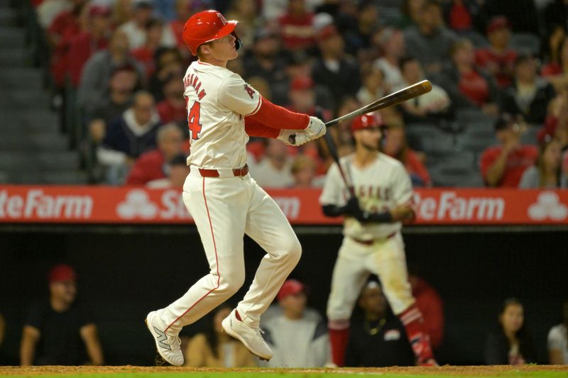 Sep 17, 2024; Anaheim, California, USA;  Los Angeles Angels third baseman Eric Wagaman (34) hits a solo home run in the sixth inning against the Chicago White Sox at Angel Stadium. Mandatory Credit: Jayne Kamin-Oncea-Imagn Images