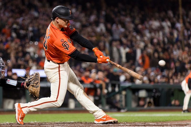 Aug 30, 2024; San Francisco, California, USA; San Francisco Giants third baseman Matt Chapman (26) hits a three-RBI double against the Miami Marlins during the eighth inning at Oracle Park. Mandatory Credit: John Hefti-USA TODAY Sports