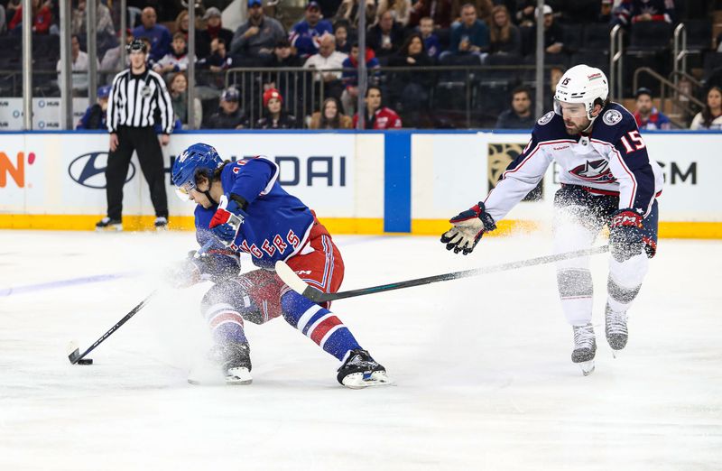 Jan 18, 2025; New York, New York, USA; New York Rangers left wing Artemi Panarin (10) evades Columbus Blue Jackets defenseman Dante Fabbro (15) during the third period at Madison Square Garden. Mandatory Credit: Danny Wild-Imagn Images