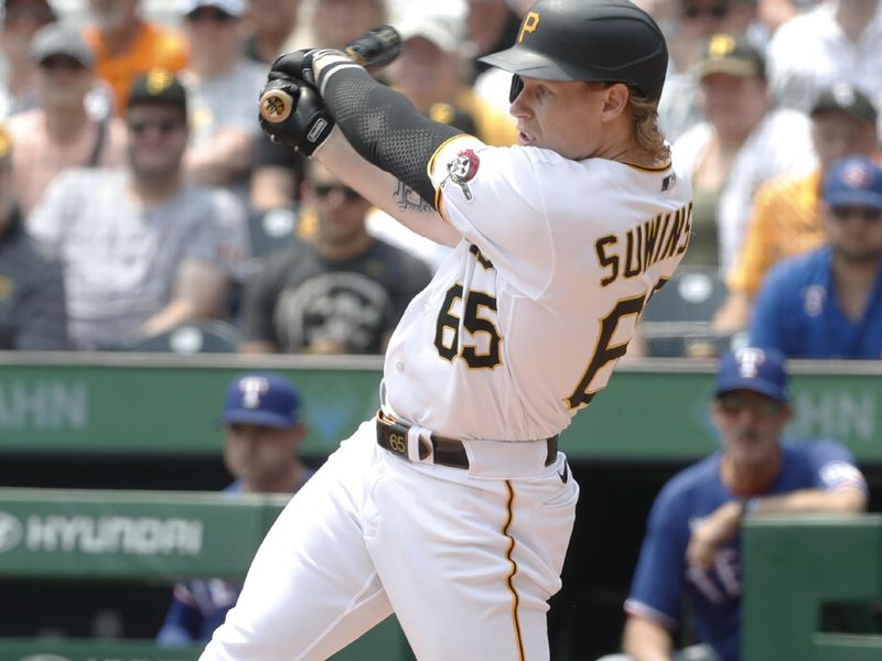 May 24, 2023; Pittsburgh, Pennsylvania, USA; Pittsburgh Pirates center fielder Jack Suwinski (65) drives in a run on a fielders choice against the Texas Rangers second inning at PNC Park. Mandatory Credit: Charles LeClaire-USA TODAY Sports