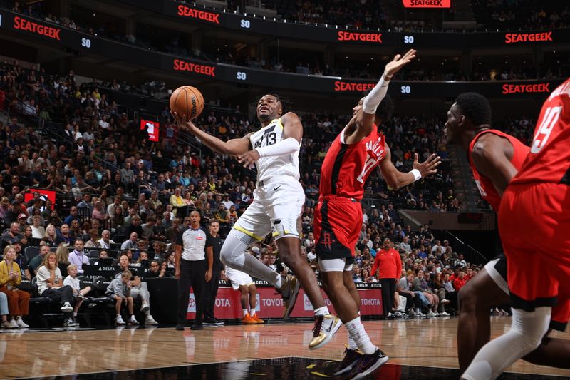 SALT LAKE CITY, UT - OCTOBER 7: Isaiah Collier #13 of the Utah Jazz drives to the basket during the game against the Houston Rockets during a NBA preseason game on October 7, 2024 at the Delta Center in Salt Lake City, Utah. NOTE TO USER: User expressly acknowledges and agrees that, by downloading and or using this Photograph, User is consenting to the terms and conditions of the Getty Images License Agreement. Mandatory Copyright Notice: Copyright 2024 NBAE (Photo by Melissa Majchrzak/NBAE via Getty Images)