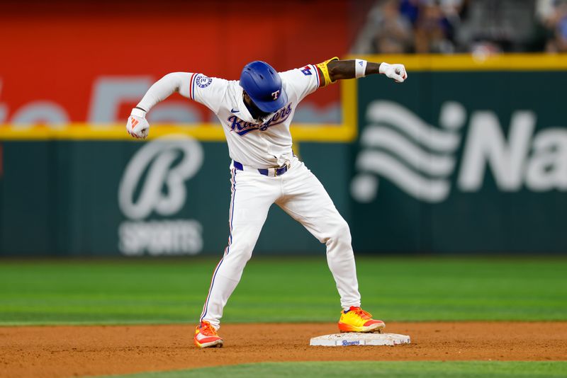 Sep 4, 2024; Arlington, Texas, USA; Texas Rangers designated hitter Adolis García (53) reacts after hitting a double during the sixth inning against the New York Yankees at Globe Life Field. Mandatory Credit: Andrew Dieb-Imagn Images