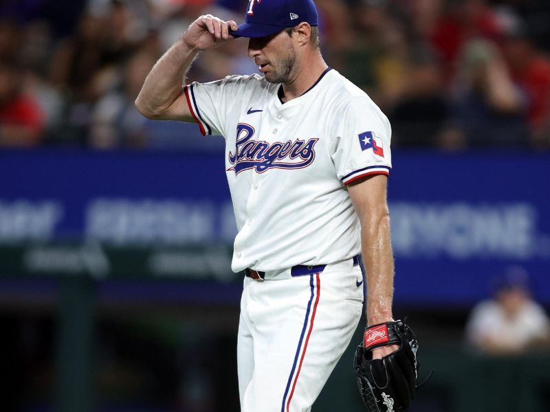 Jul 20, 2024; Arlington, Texas, USA;  Texas Rangers starting pitcher Max Scherzer (31) reacts after giving up a run against the Baltimore Orioles in the second inning at Globe Life Field. Mandatory Credit: Tim Heitman-USA TODAY Sports