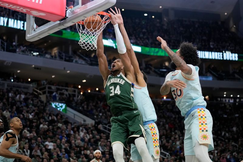 MILWAUKEE, WISCONSIN - JANUARY 08: Giannis Antetokounmpo #34 of the Milwaukee Bucks dunks the ball against Victor Wembanyama #1 of the San Antonio Spurs during the first quarter at Fiserv Forum on January 08, 2025 in Milwaukee, Wisconsin. NOTE TO USER: User expressly acknowledges and agrees that, by downloading and or using this photograph, User is consenting to the terms and conditions of the Getty Images License Agreement. (Photo by Patrick McDermott/Getty Images)