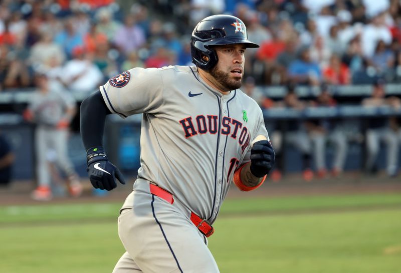 May 20, 2025; St. Petersburg, Florida, USA; Houston Astros catcher Victor Caratini (17) doubles during the second inning against the Tampa Bay Rays at George M. Steinbrenner Field. Mandatory Credit: Kim Klement Neitzel-Imagn Images
