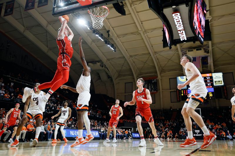 Jan 26, 2023; Corvallis, Oregon, USA; Utah Utes center Branden Carlson (35) goes up for a dunk against Oregon State Beavers forward Rodrigue Angela (34) during the second half at Gill Coliseum. Mandatory Credit: Soobum Im-USA TODAY Sports