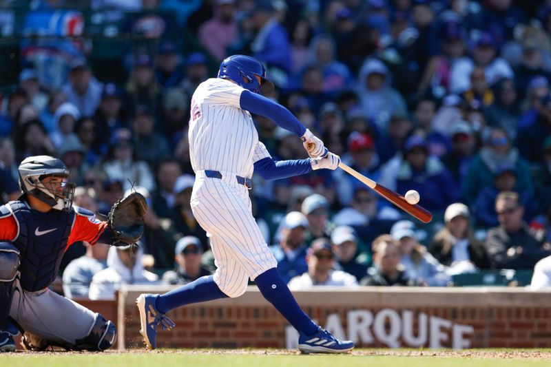 Apr 25, 2024; Chicago, Illinois, USA; Chicago Cubs centerfielder Pete Crow-Armstrong (52) hits a two-run home run against the Houston Astros during the sixth inning at Wrigley Field. Mandatory Credit: Kamil Krzaczynski-USA TODAY Sports