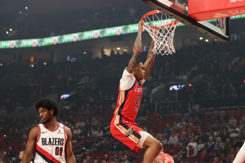 PORTLAND, OREGON - OCTOBER 27: Jordan Hawkins #24 of the New Orleans Pelicans dunks against the Portland Trail Blazers during the first quarter at Moda Center on October 27, 2024 in Portland, Oregon. NOTE TO USER: User expressly acknowledges and agrees that, by downloading and or using this photograph, User is consenting to the terms and conditions of the Getty Images License Agreement.?<p><br/></p> (Photo by Amanda Loman/Getty Images)