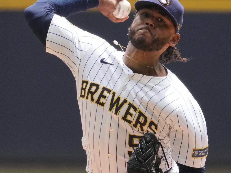 Jun 8, 2025; Milwaukee, Wisconsin, USA; Milwaukee Brewers pitcher Freddy Peralta (51) delivers a pitch against the San Diego Padres in the first inning at American Family Field. Mandatory Credit: Michael McLoone-Imagn Images