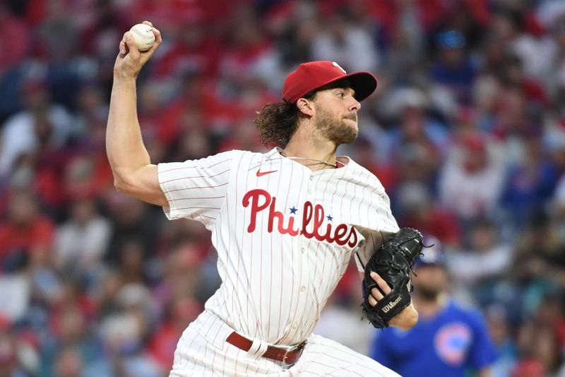 Sep 23, 2024; Philadelphia, Pennsylvania, USA; Philadelphia Phillies pitcher Aaron Nola (27) throws a pitch during the first inning against the Chicago Cubs at Citizens Bank Park. Mandatory Credit: Eric Hartline-Imagn Images