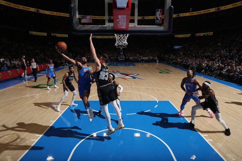 OKLAHOMA CITY, OK - APRIL 10:  Aaron Wiggins #21 of the Oklahoma City Thunder drives to the basket during the game against the San Antonio Spurs on April 10, 2024 at Paycom Arena in Oklahoma City, Oklahoma. NOTE TO USER: User expressly acknowledges and agrees that, by downloading and or using this photograph, User is consenting to the terms and conditions of the Getty Images License Agreement. Mandatory Copyright Notice: Copyright 2024 NBAE (Photo by Zach Beeker/NBAE via Getty Images)