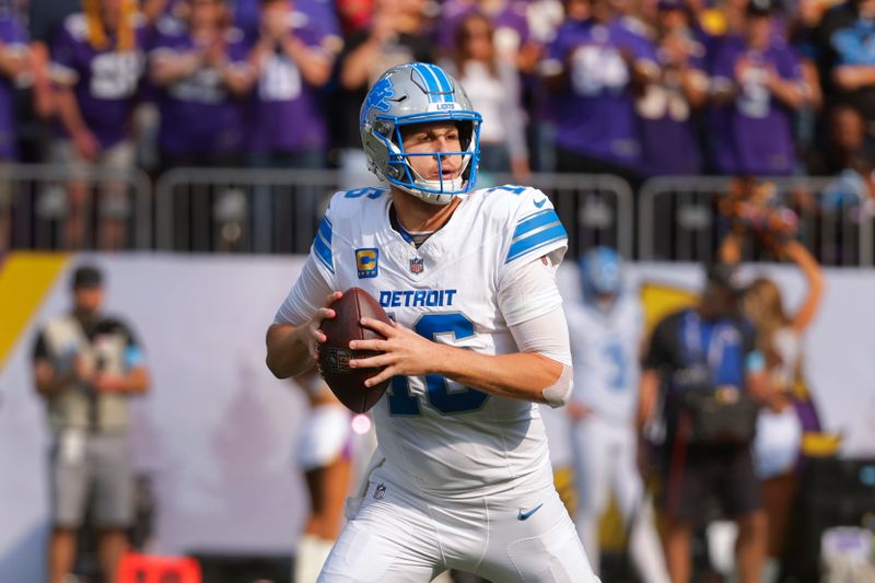 Detroit Lions quarterback Jared Goff (16) looks to throw against the Minnesota Vikings during the first half of an NFL football game Sunday, Oct. 20, 2024, in Minneapolis. (AP Photo/Bruce Kluckhohn)