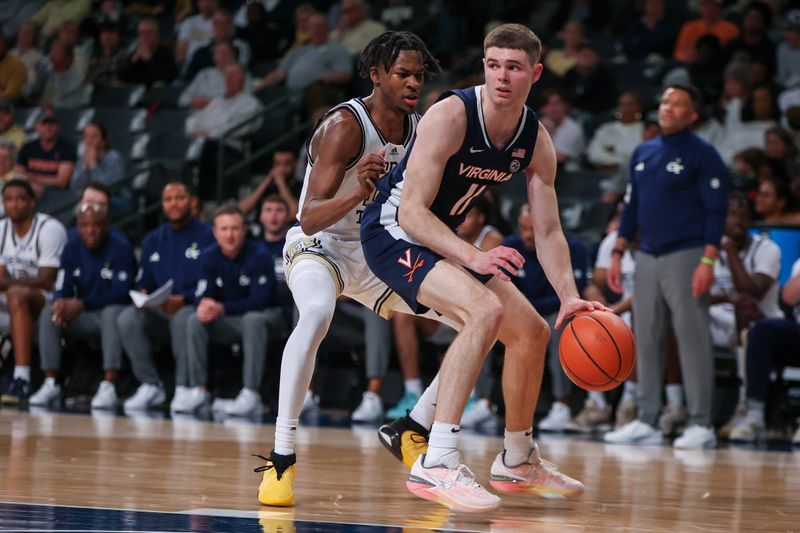 Jan 20, 2024; Atlanta, Georgia, USA; Virginia Cavaliers guard Isaac McKneely (11) is defended by Georgia Tech Yellow Jackets guard Miles Kelly (13) in the second half at McCamish Pavilion. Mandatory Credit: Brett Davis-USA TODAY Sports