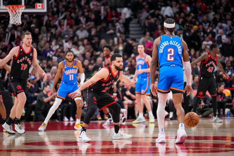 TORONTO, ON - MARCH 16: Fred VanVleet #23 of the Toronto Raptors gaurds Shai Gilgeous-Alexander #2 of the Oklahoma City Thunder during the second half of their basketball game at the Scotiabank Arena on March 16, 2023 in Toronto, Ontario, Canada. NOTE TO USER: User expressly acknowledges and agrees that, by downloading and/or using this Photograph, user is consenting to the terms and conditions of the Getty Images License Agreement. (Photo by Mark Blinch/Getty Images)