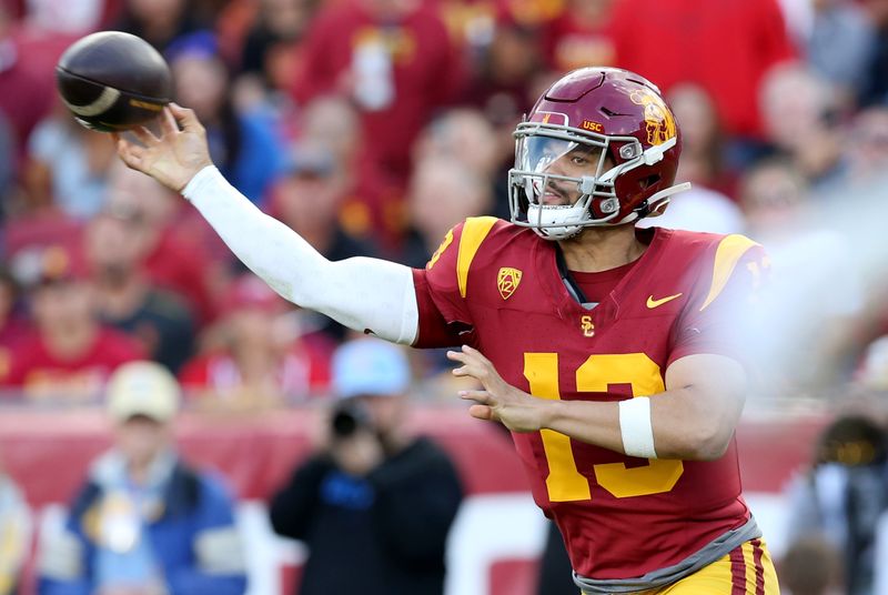 Nov 18, 2023; Los Angeles, California, USA; USC Trojans quarterback Caleb Williams (13) throws during the second quarter against the UCLA Bruins at United Airlines Field at Los Angeles Memorial Coliseum. Mandatory Credit: Jason Parkhurst-USA TODAY Sports