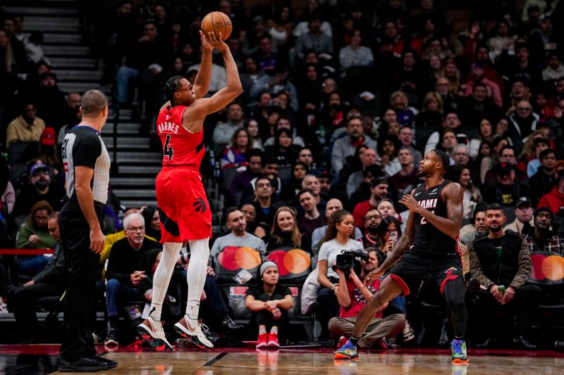 TORONTO, ON - DECEMBER 1: Scottie Barnes #4 of the Toronto Raptors shoots the ball against Haywood Highsmith #24 of the Miami Heat at Scotiabank Arena on December 1, 2024 in Toronto, Ontario, Canada. NOTE TO USER: User expressly acknowledges and agrees that, by downloading and/or using this Photograph, user is consenting to the terms and conditions of the Getty Images License Agreement. (Photo by Andrew Lahodynskyj/Getty Images)