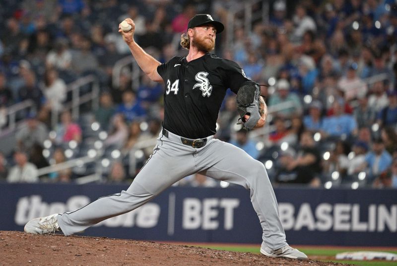 May 21, 2024; Toronto, Ontario, CAN;  Chicago White Sox relief pitcher Michael Kopech (34) delivers a pitch against the Toronto Blue Jays in the ninth inning at Rogers Centre. Mandatory Credit: Dan Hamilton-USA TODAY Sports