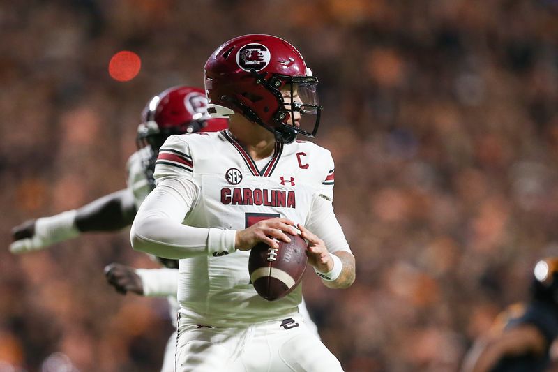 Sep 30, 2023; Knoxville, Tennessee, USA; South Carolina Gamecocks quarterback Spencer Rattler (7) looks to pass the ball against the Tennessee Volunteers during the first half at Neyland Stadium. Mandatory Credit: Randy Sartin-USA TODAY Sports