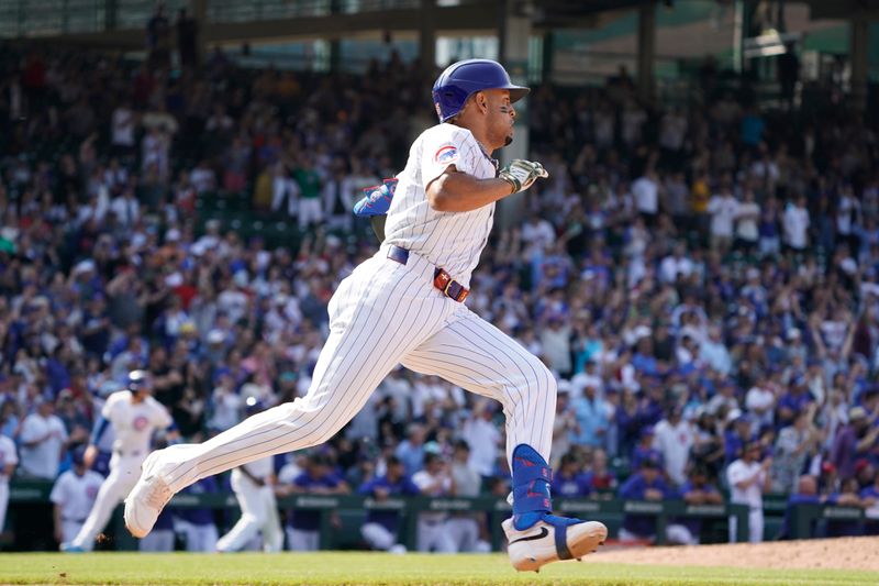 May 17, 2024; Chicago, Illinois, USA; Chicago Cubs third baseman Christopher Morel (5) runs after hitting a two run double against the Pittsburgh Pirates during the eighth inning at Wrigley Field. Mandatory Credit: David Banks-USA TODAY Sports