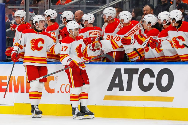 Sep 23, 2024; Edmonton, Alberta, CAN; The Calgary Flames celebrate a goal scored by forward Matt Coronato (27) during the third period against the Edmonton Oilers at Rogers Place. Mandatory Credit: Perry Nelson-Imagn Images