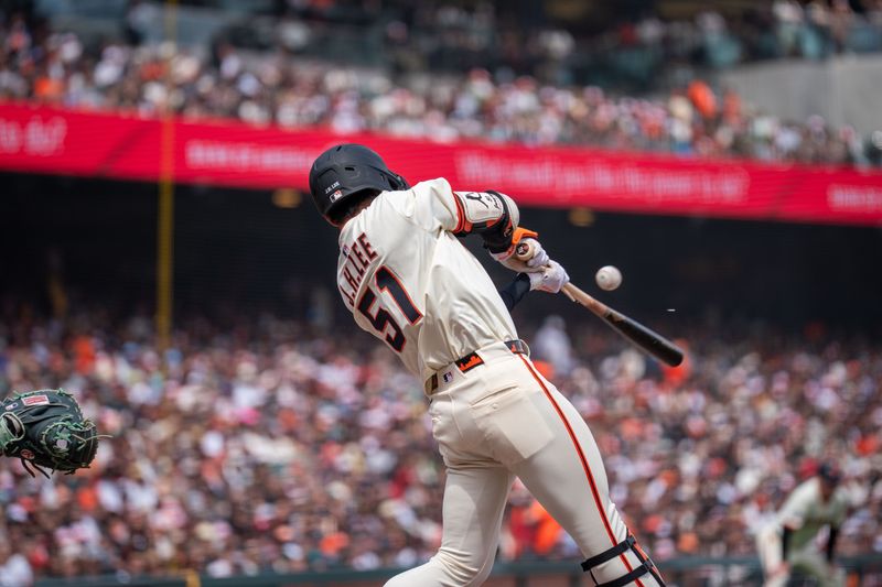 Apr 6, 2025; San Francisco, California, USA; San Francisco Giants center fielder Jung Hoo Lee (51) hits a single to Seattle Mariners left fielder Randy Arozarena (not pictured) during the fourth inning at Oracle Park. Mandatory Credit: Neville E. Guard-Imagn Images