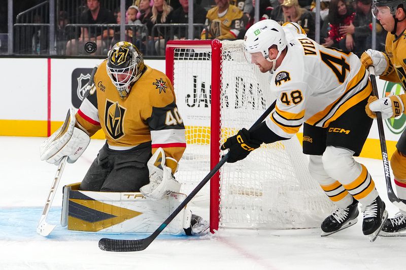 Oct 16, 2025; Las Vegas, Nevada, USA; Vegas Golden Knights goaltender Akira Schmid (40) makes a save against Boston Bruins left wing Jeffrey Viel (48) during the first period at T-Mobile Arena. Mandatory Credit: Stephen R. Sylvanie-Imagn Images