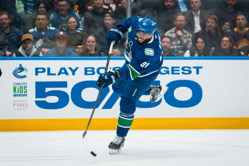 Nov 5, 2025; Vancouver, British Columbia, CAN; Vancouver Canucks forward Evander Kane (91) shoots against the Chicago Blackhawks in the second period at Rogers Arena. Mandatory Credit: Bob Frid-Imagn Images