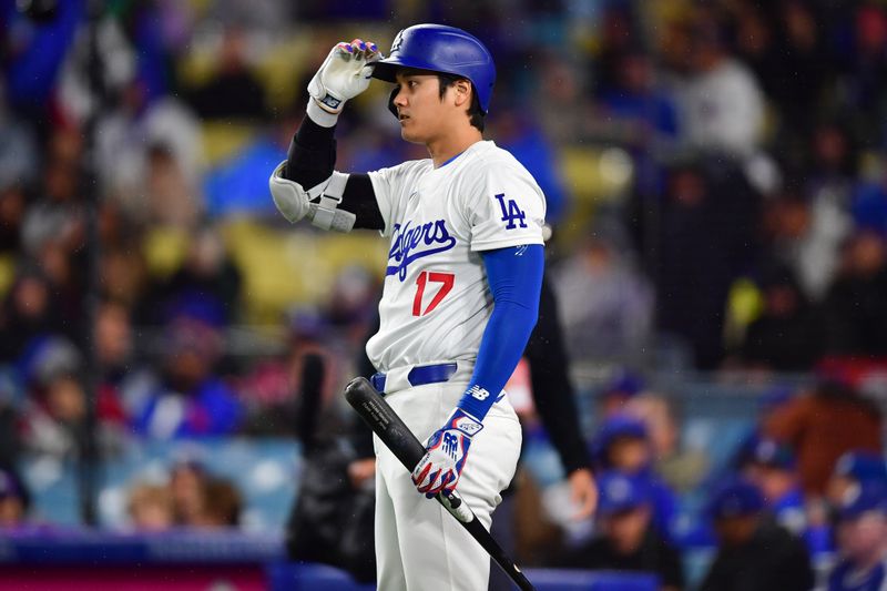 Apr 13, 2024; Los Angeles, California, USA; Los Angeles Dodgers designated hitter Shohei Ohtani (17) on deck before hitting against the San Diego Padres during the first inning at Dodger Stadium. Mandatory Credit: Gary A. Vasquez-USA TODAY Sports