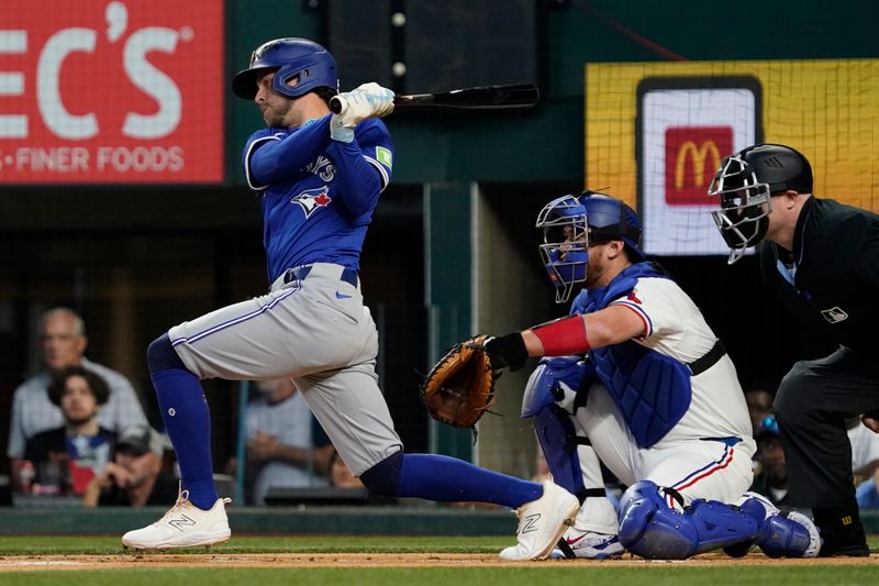Sep 19, 2024; Arlington, Texas, USA; Toronto Blue Jays third baseman Ernie Clement (28) hits a single during the first inning against the Texas Rangers at Globe Life Field. Mandatory Credit: Raymond Carlin III-Imagn Images