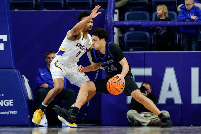 Jan 13, 2024; Colorado Springs, Colorado, USA; Air Force Falcons guard Jeffrey Mills (24) controls the ball as San Jose State Spartans guard Myron Amey Jr. (0) guards in the second half at Clune Arena. Mandatory Credit: Isaiah J. Downing-USA TODAY Sports