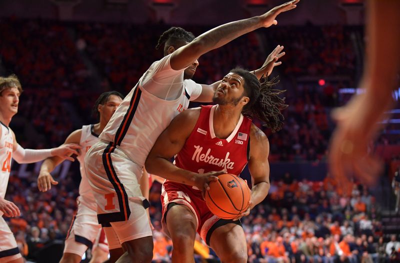 Jan 31, 2023; Champaign, Illinois, USA; Nebraska Cornhuskers forward Derrick Walker (13) looks to the basket while defended by Illinois Fighting Illini forward Dain Dainja (42) during the second half at State Farm Center. Mandatory Credit: Ron Johnson-USA TODAY Sports