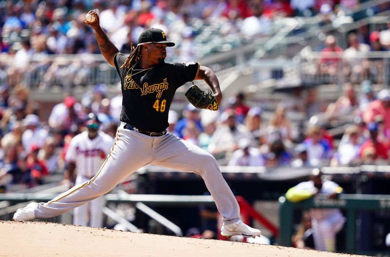 Sep 10, 2023; Cumberland, Georgia, USA; Pittsburgh Pirates starting pitcher Luis Ortiz (48) pitching the against Atlanta Braves during the fifth inning at Truist Park. Mandatory Credit: John David Mercer-USA TODAY Sports