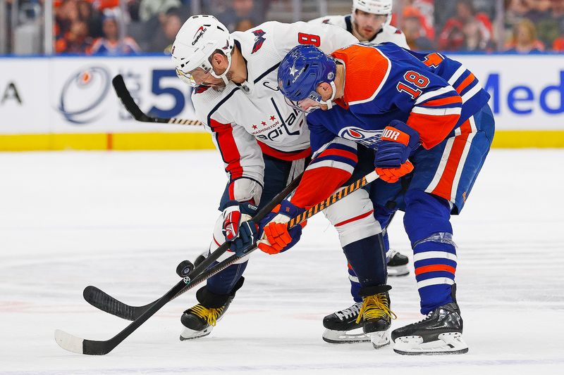 Mar 13, 2024; Edmonton, Alberta, CAN; Washington Capitals forward Alex Ovechkin (8) and Edmonton Oilers forward Zach Hyman (18) battle for a loose puck during the second periodat Rogers Place. Mandatory Credit: Perry Nelson-USA TODAY Sports