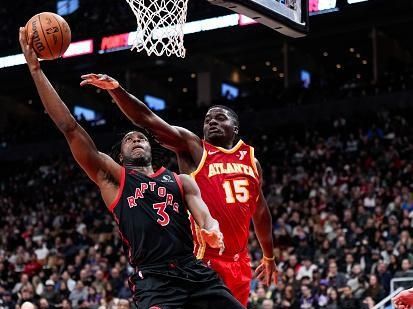 TORONTO, ON - DECEMBER 15: O.G. Anunoby #3 of the Toronto Raptors shoots the ball against Clint Capela #15 of the Atlanta Hawks during the second half of their basketball game at the Scotiabank Arena on December 15, 2023 in Toronto, Ontario, Canada. NOTE TO USER: User expressly acknowledges and agrees that, by downloading and/or using this Photograph, user is consenting to the terms and conditions of the Getty Images License Agreement. (Photo by Mark Blinch/Getty Images)