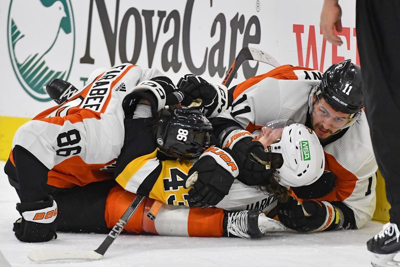 Jan 8, 2024; Philadelphia, Pennsylvania, USA; Philadelphia Flyers left wing Joel Farabee (86) and right wing Travis Konecny (11) battle with Pittsburgh Penguins center Jansen Harkins (43) during the second period at Wells Fargo Center. Mandatory Credit: Eric Hartline-USA TODAY Sports