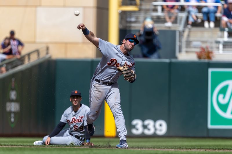 Aug 16, 2023; Minneapolis, Minnesota, USA; Detroit Tigers third baseman Matt Vierling (8) throws the ball to first base for an out against the Minnesota Twins in the eighth inning at Target Field. Mandatory Credit: Jesse Johnson-USA TODAY Sports