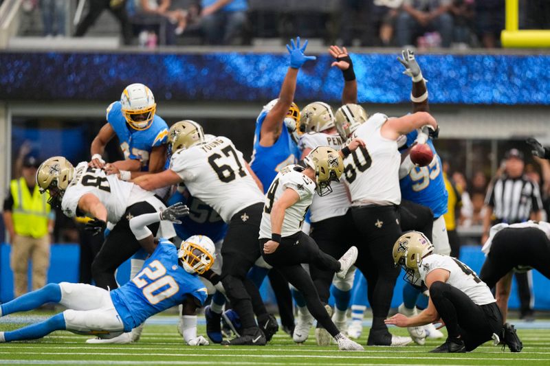 New Orleans Saints place kicker Blake Grupe (19) kicks a field goal in the first half of an NFL football game against the Los Angeles Chargers in Inglewood, Calif., Sunday, Oct. 27, 2024. (AP Photo/Mark J. Terrill)