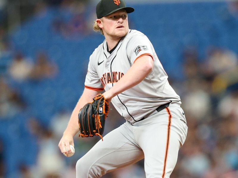 Apr 13, 2024; St. Petersburg, Florida, USA;  San Francisco Giants pitcher Logan Webb (62) throws a pitch against the Tampa Bay Rays in the first inning at Tropicana Field. Mandatory Credit: Nathan Ray Seebeck-USA TODAY Sports