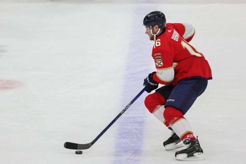 Feb 27, 2024; Sunrise, Florida, USA; Florida Panthers center Aleksander Barkov (16) moves the puck against the Buffalo Sabres during the first period at Amerant Bank Arena. Mandatory Credit: Sam Navarro-USA TODAY Sports