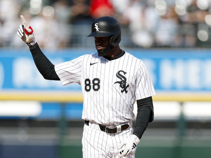 May 24, 2025; Chicago, Illinois, USA; Chicago White Sox center fielder Luis Robert Jr. (88) celebrates after hitting a double against the Texas Rangers during the fourth inning at Rate Field. Mandatory Credit: Kamil Krzaczynski-Imagn Images