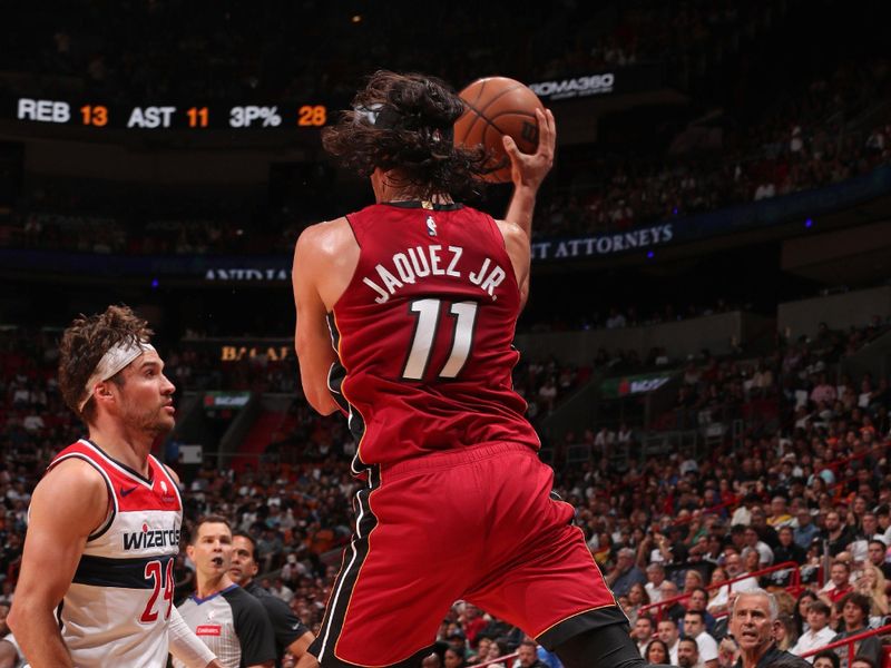 MIAMI, FL - MARCH 10: Jaime Jaquez Jr. #11 of the Miami Heat passes the ball during the game against the Washington Wizards on March 10, 2024 at Kaseya Center in Miami, Florida. NOTE TO USER: User expressly acknowledges and agrees that, by downloading and or using this Photograph, user is consenting to the terms and conditions of the Getty Images License Agreement. Mandatory Copyright Notice: Copyright 2024 NBAE (Photo by Issac Baldizon/NBAE via Getty Images)