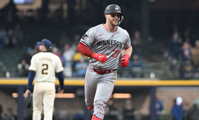 Apr 3, 2024; Milwaukee, Wisconsin, USA; Minnesota Twins catcher Ryan Jeffers (27) hits a home run against the Milwaukee Brewers in the seventh inning at American Family Field. Mandatory Credit: Michael McLoone-USA TODAY Sports