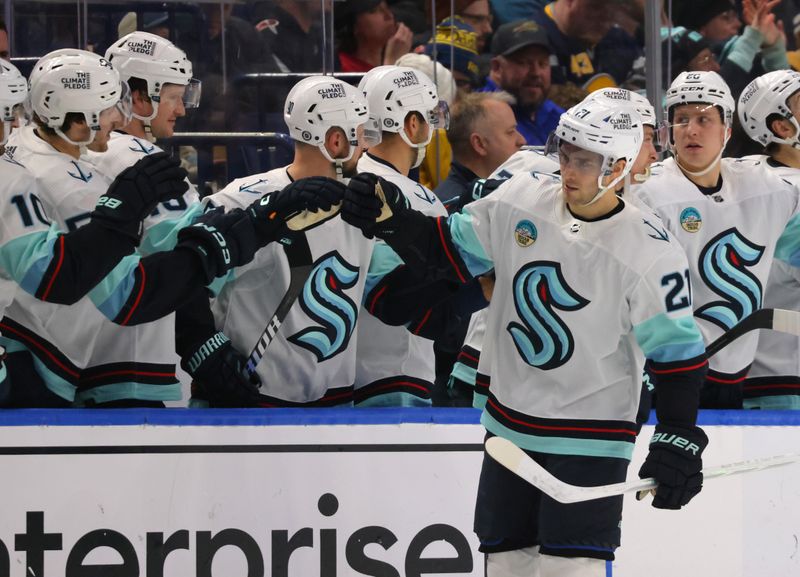 Jan 9, 2024; Buffalo, New York, USA;  Seattle Kraken center Alex Wennberg (21) celebrates his goal with teammates during the second period against the Buffalo Sabres at KeyBank Center. Mandatory Credit: Timothy T. Ludwig-USA TODAY Sports