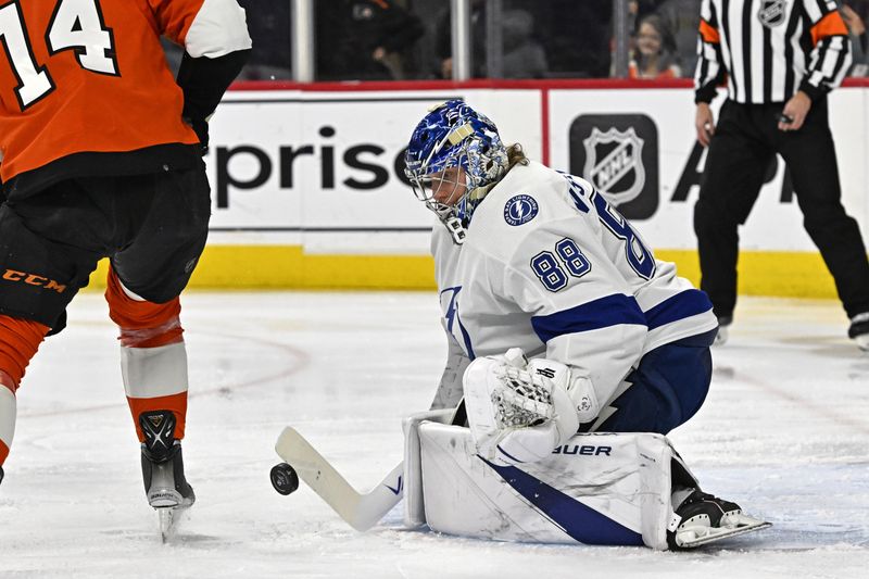 Jan 23, 2024; Philadelphia, Pennsylvania, USA; Tampa Bay Lightning goaltender Andrei Vasilevskiy (88) makes a save against the Philadelphia Flyers during the first period at Wells Fargo Center. Mandatory Credit: Eric Hartline-USA TODAY Sports