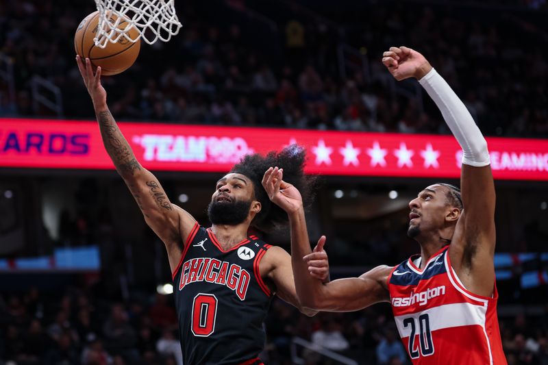 WASHINGTON, DC - JANUARY 01: Coby White #0 of the Chicago Bulls shoots the ball in front of Alexandre Sarr #20 of the Washington Wizards during the first half at Capital One Arena on January 1, 2025 in Washington, DC. NOTE TO USER: User expressly acknowledges and agrees that, by downloading and or using this photograph, User is consenting to the terms and conditions of the Getty Images License Agreement. (Photo by Scott Taetsch/Getty Images)