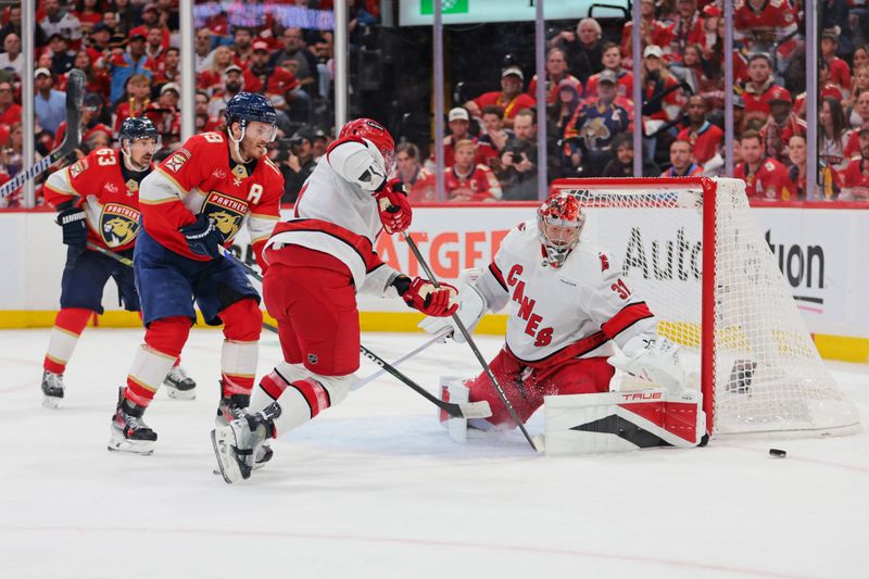 May 26, 2025; Sunrise, Florida, USA; Carolina Hurricanes goaltender Frederik Andersen (31) makes a save against Florida Panthers center Evan Rodrigues (17) during the third period in game four of the Eastern Conference Final of the 2025 Stanley Cup Playoffs at Amerant Bank Arena. Mandatory Credit: Sam Navarro-Imagn Images
