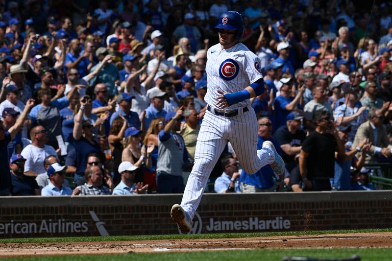 Sep 6, 2023; Chicago, Illinois, USA;  Chicago Cubs left fielder Ian Happ (8) scores a run against the San Francisco Giants during the first inning at Wrigley Field. Mandatory Credit: Matt Marton-USA TODAY Sports